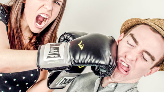 girl hitting guy with strong right hook