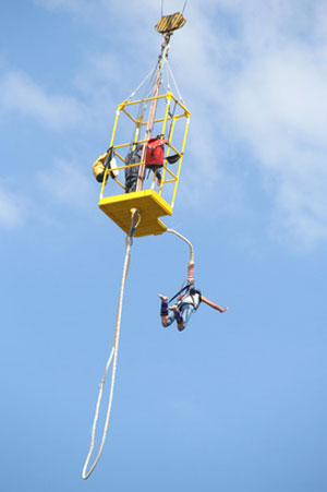 woman as seen bungjee jumping from a crane