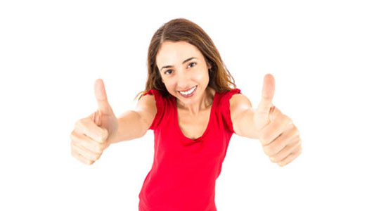 positive woman in red shirt holding thumbs up