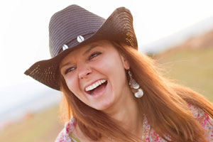 Woman with a nice laugh in a cowboy hat