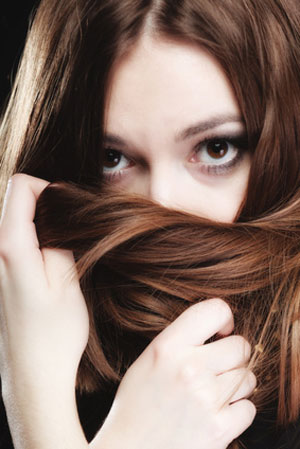 woman hiding behind hair