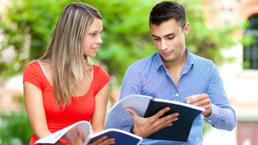 guy showing girl his notes