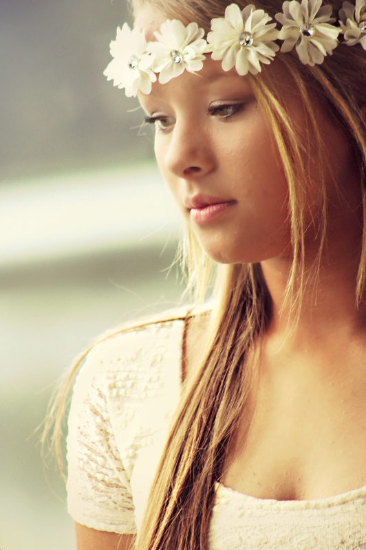 Girl with white flowers in her hair.