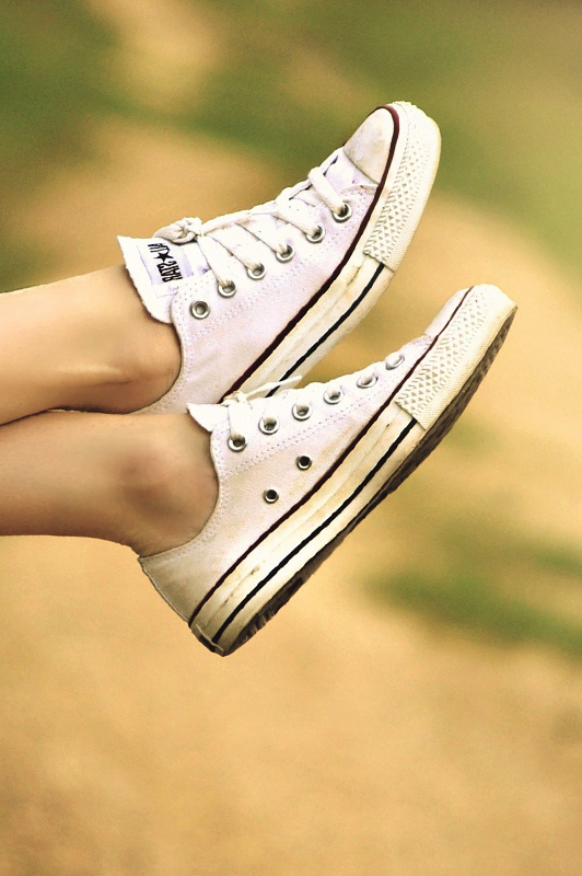 White converse sneakers on a girl's feet