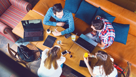 group of young people studying in cafe