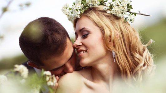 groom kissing shoulder