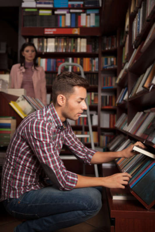 guy taking book out of shelf