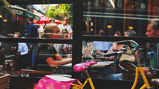 couple sitting outside a cafe and talking