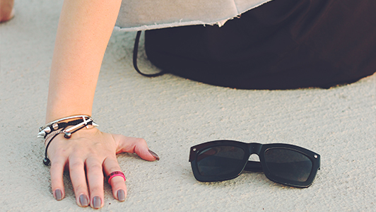 Girl resting her hands while seating.