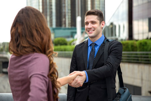 man and woman shaking hands