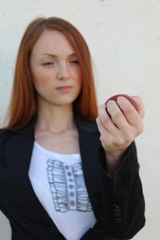 women squeezing a ball