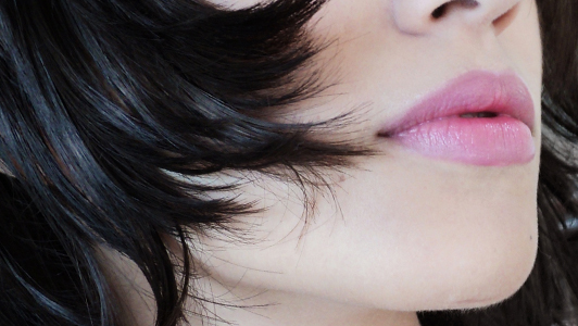 Close up of lips of a brunette.