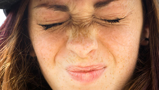 young woman with eyes closed shut