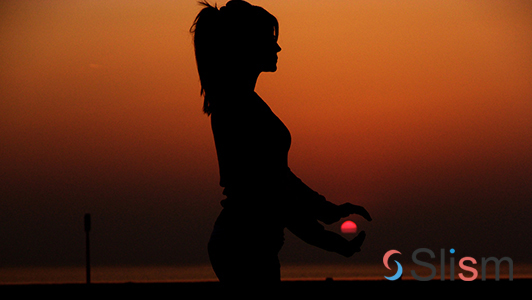 girl practicing yoga in the sunset