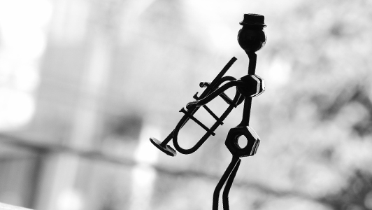 A figurine of a trumpet player made of spare parts.