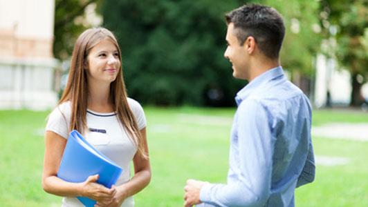 students talking in courtyard