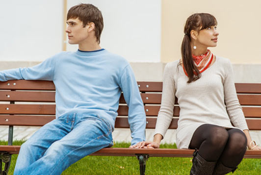 man and woman on bench