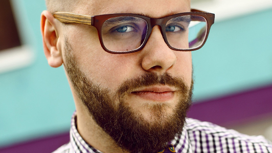 Guy with hipster glasses and a beard.