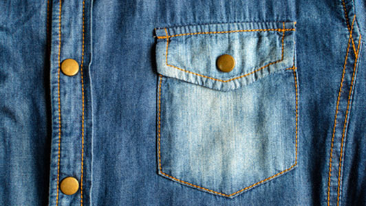 bleached denim jacket pocket close up