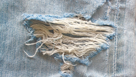 section of tear on denim material