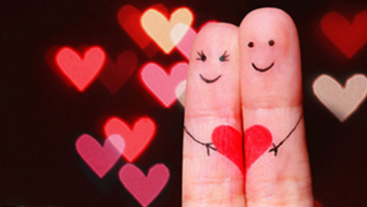 fingers embracing heart