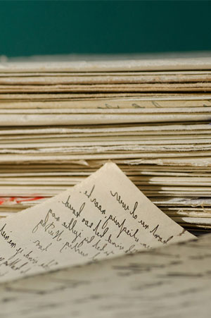 stack of paper with cursive writing