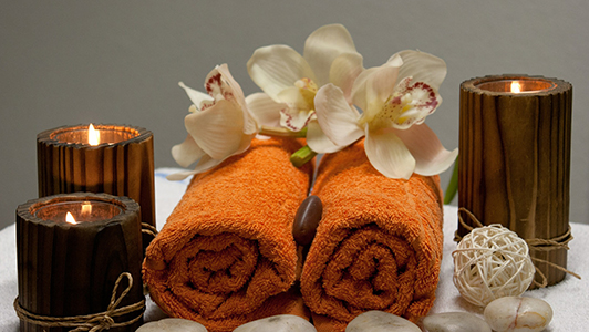 towels, scented candles and flowers