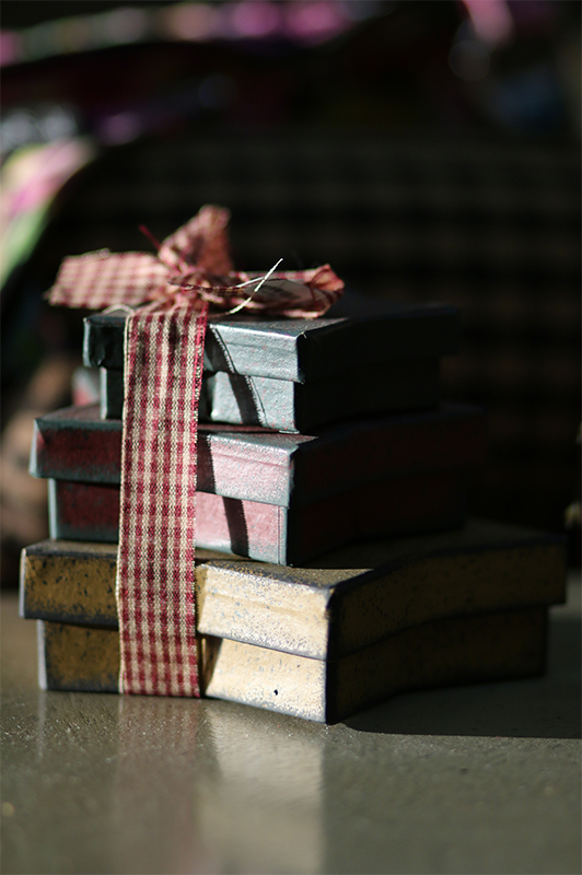 stack of old boxes with a bow