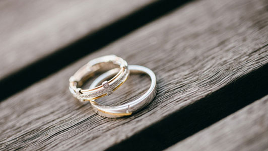 wedding rings on wood