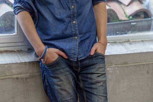 denim guy with hands in pocket