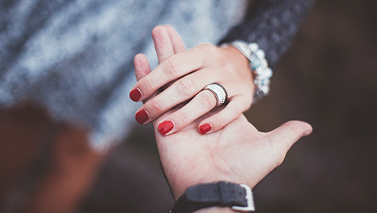 Guy offering his hand to a girl.