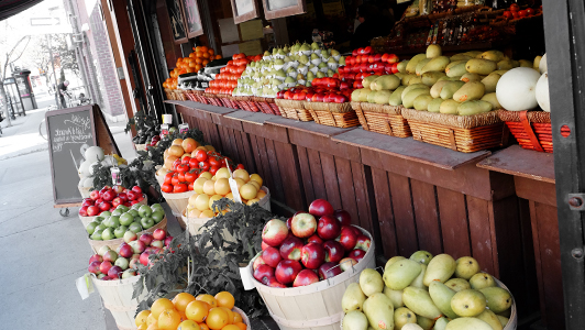 Baskets and buckets with fruit and vegetables.