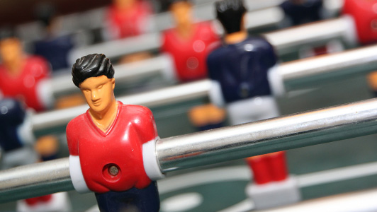 A 'player' on a foosball table.