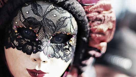 Girl with a Venetian mask with black lace