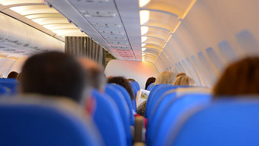 Passengers sitting in a plane.