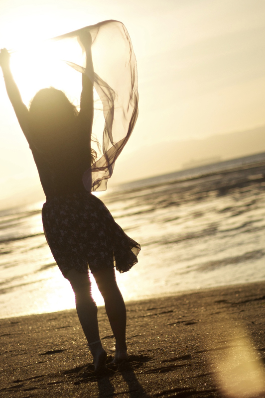 Girl holding his arms in the air.