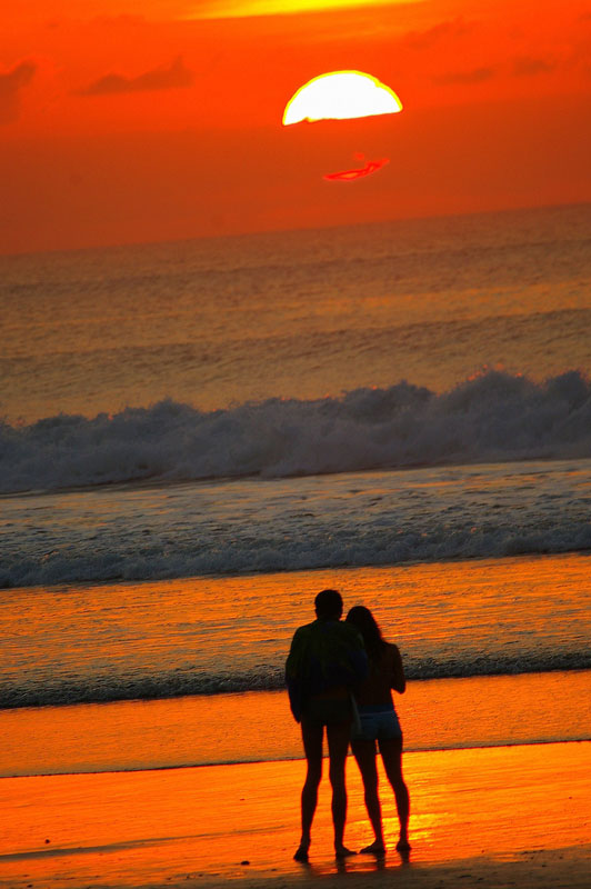 couple at beach watching sunset