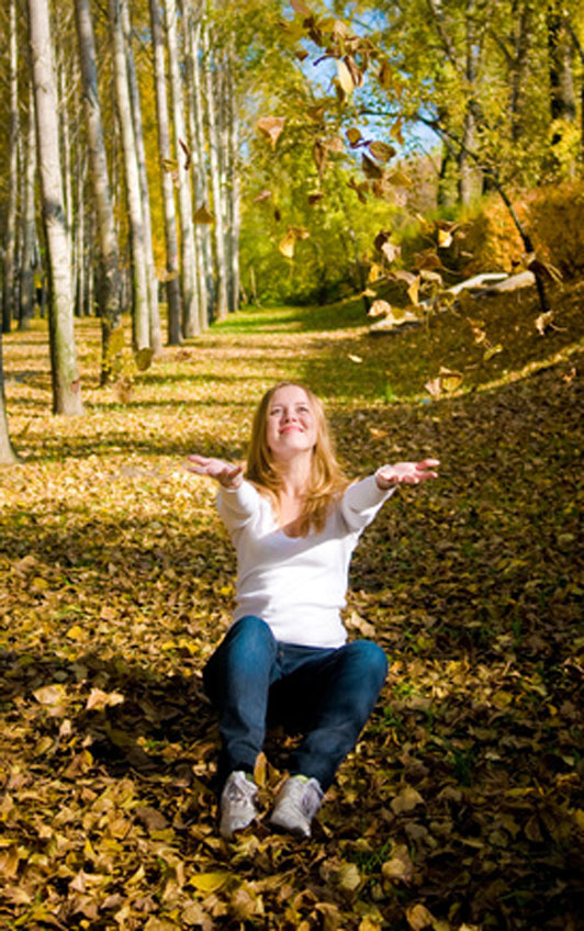 girl catching leaves