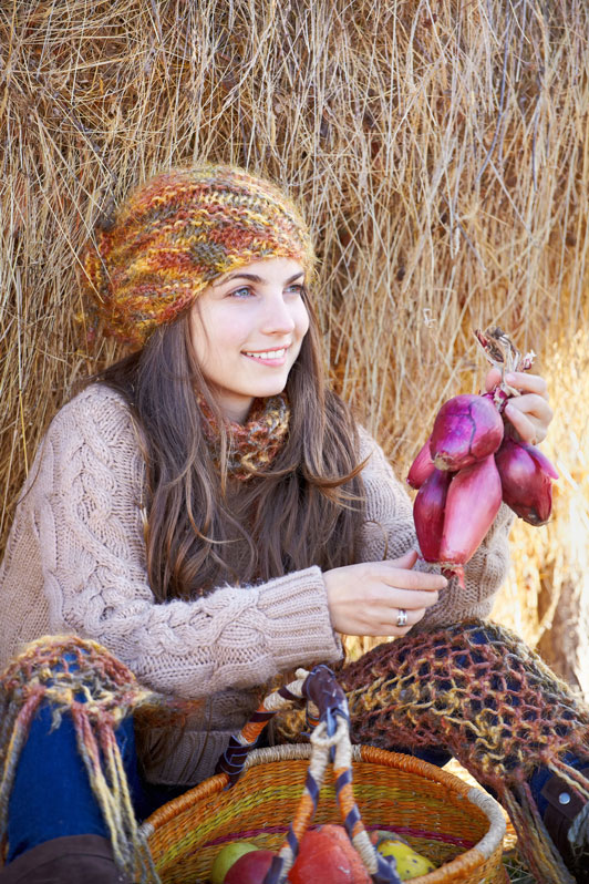 girl holding vegetables