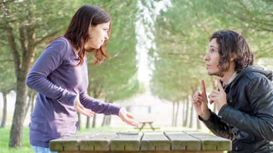 querrel between couple on park bench table