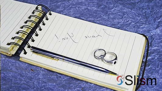 love note, rings, and a pen