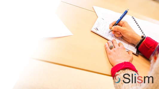 hands of a woman writing a letter