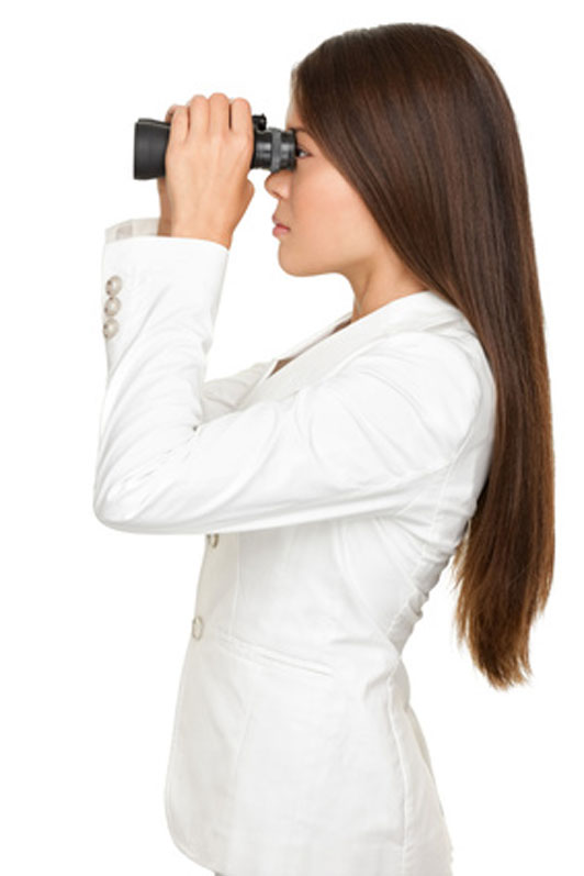 woman looking through binoculars