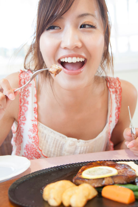girl eating with a fork