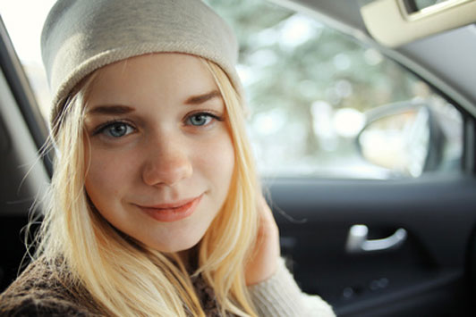 smiling girl in car