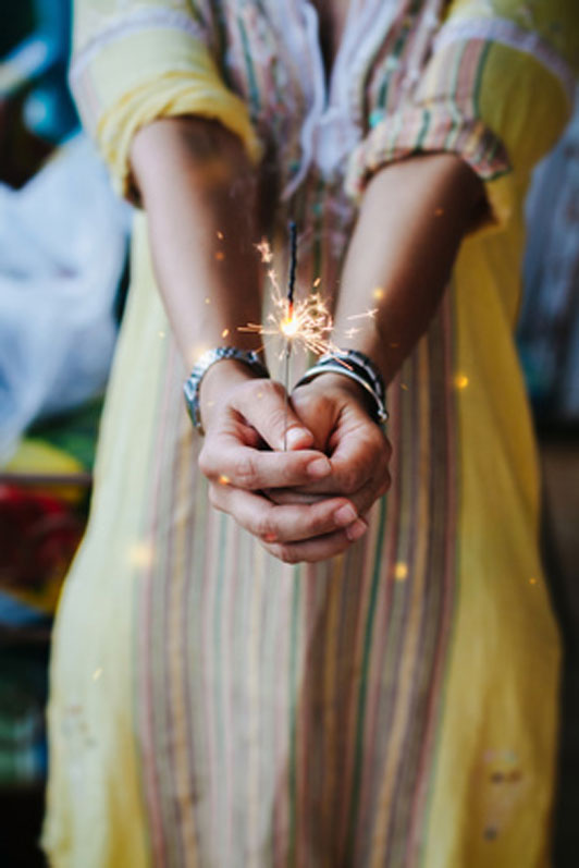 young woman with grip on fireworks