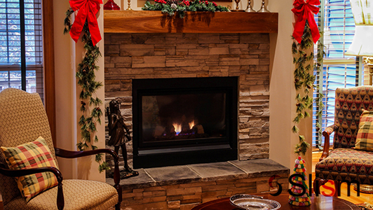 Decorated fireplace and chairs