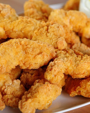 Chicken fingers served on plate