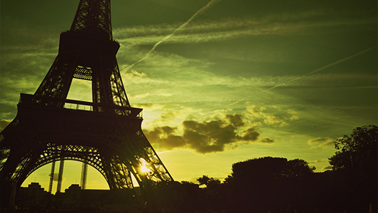 Bottom of the Eiffel Tower and a sunset