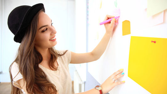 woman writing on wall